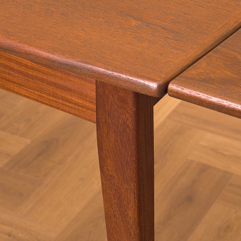 Danish dining table in teak and walnut