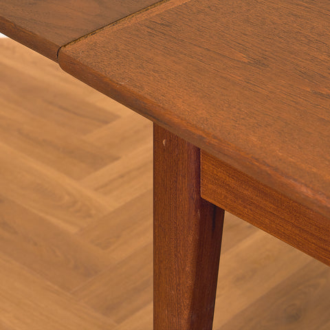 Danish dining table in teak and walnut