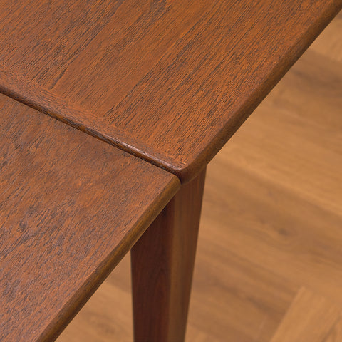 Danish dining table in teak and walnut