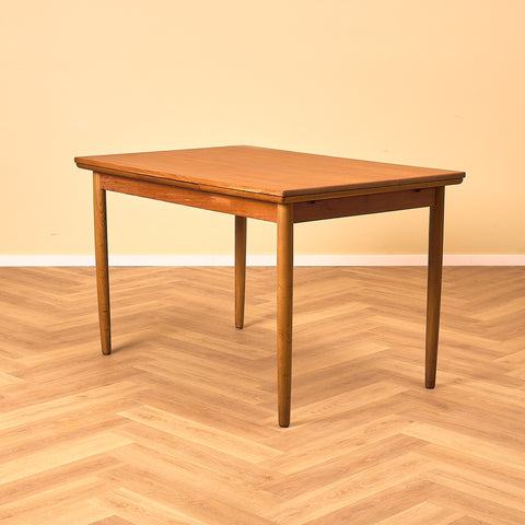 Danish dining table in teak and walnut