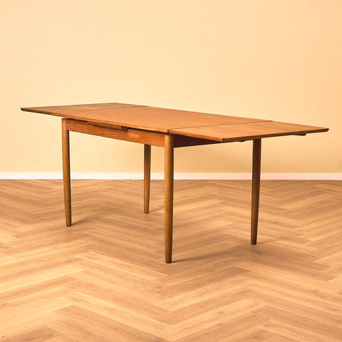Danish dining table in teak and walnut