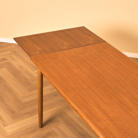 Danish dining table in teak and walnut