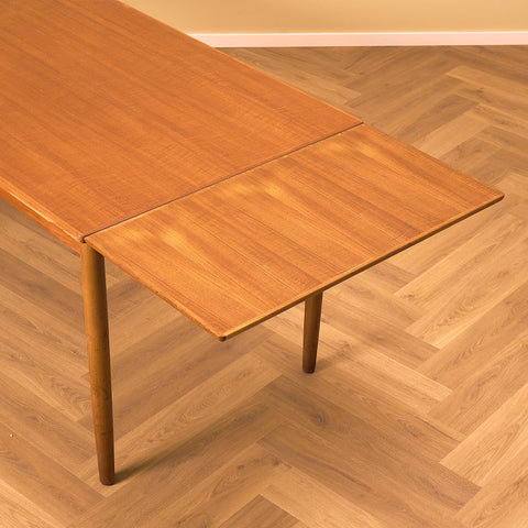 Danish dining table in teak and walnut