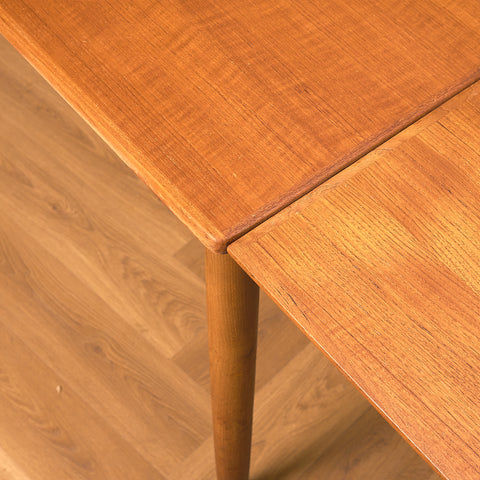 Danish dining table in teak and walnut