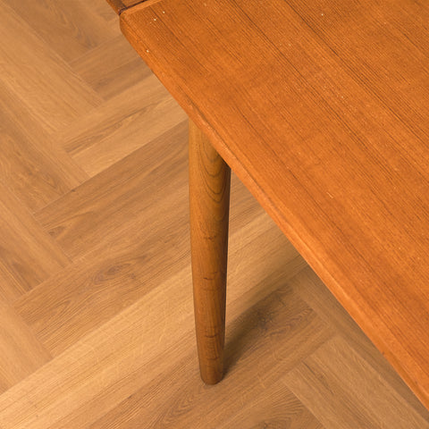 Danish dining table in teak and walnut