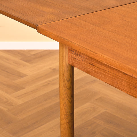 Danish dining table in teak and walnut