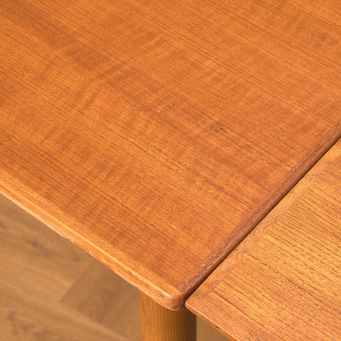 Danish dining table in teak and walnut