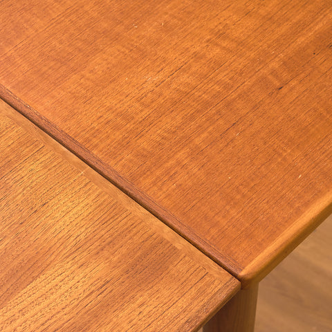 Danish dining table in teak and walnut