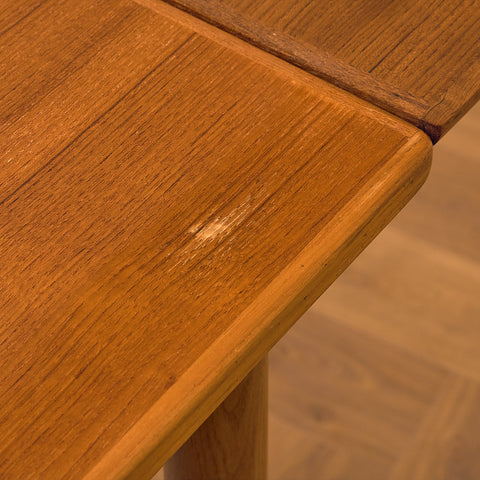 Danish dining table in teak and walnut