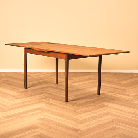 Danish dining table in teak and walnut