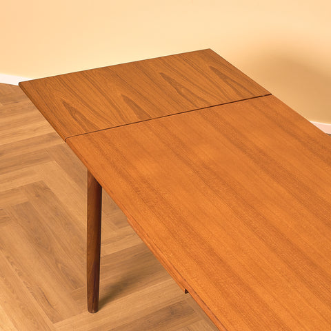 Danish dining table in teak and walnut