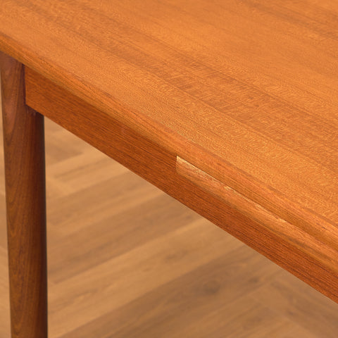Danish dining table in teak and walnut