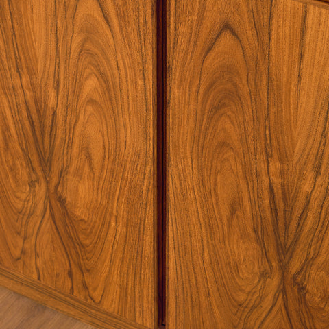 Danish corner bookshelf in Santos rosewood by Skovby