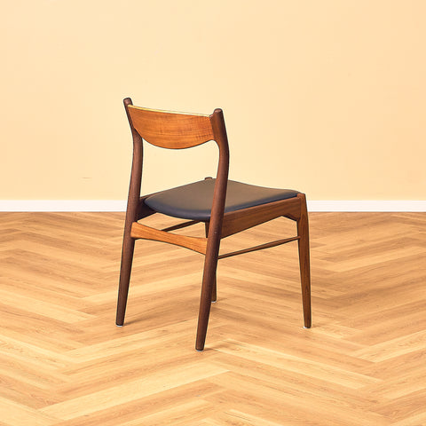 Danish dining chairs in teak and walnut by Ærthøj Jensen & Mølholm