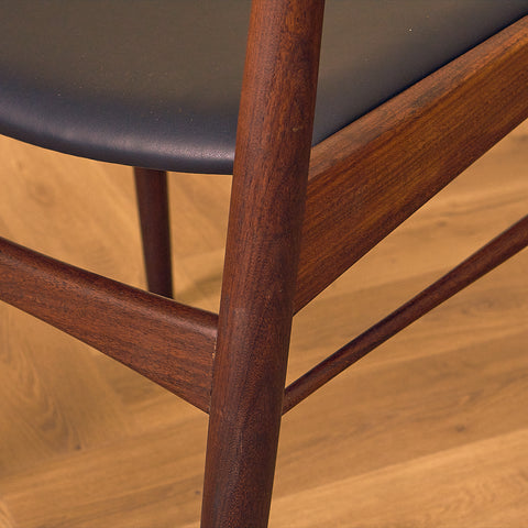 Danish dining chairs in teak and walnut by Ærthøj Jensen & Mølholm