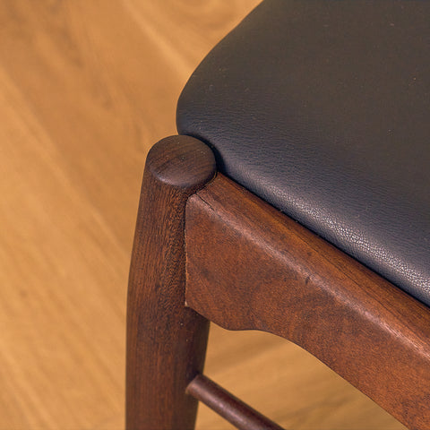 Danish dining chairs in teak and walnut by Ærthøj Jensen & Mølholm