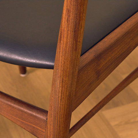 Danish dining chairs in teak and walnut by Ærthøj Jensen & Mølholm