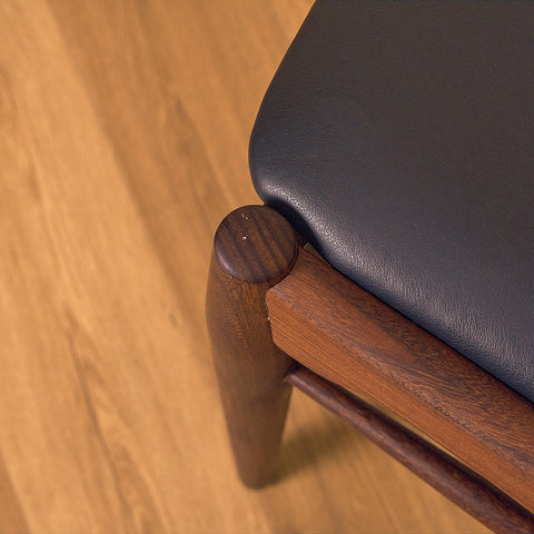 Danish dining chairs in teak and walnut by Ærthøj Jensen & Mølholm