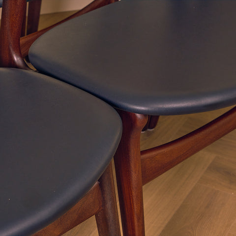 Danish dining chairs in walnut and teak by Erik Buch for Chr. Christensen Møbelfabrik, model 310