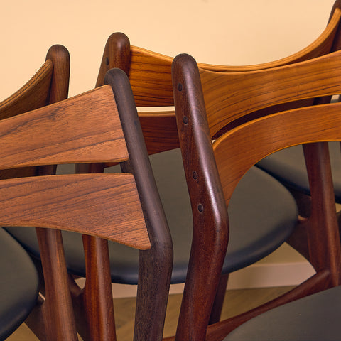 Danish dining chairs in walnut and teak by Erik Buch for Chr. Christensen Møbelfabrik, model 310