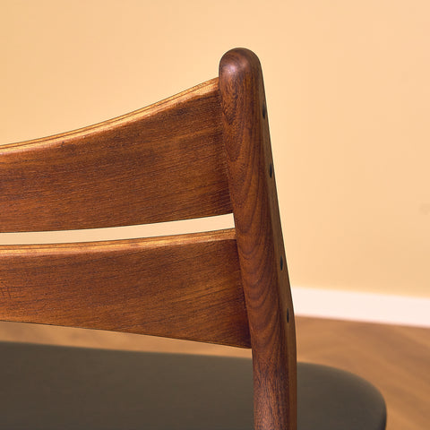 Danish dining chairs in walnut and teak by Erik Buch for Chr. Christensen Møbelfabrik, model 310