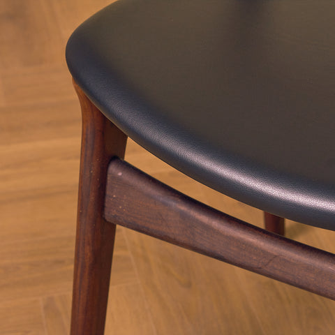 Danish dining chairs in walnut and teak by Erik Buch for Chr. Christensen Møbelfabrik, model 310