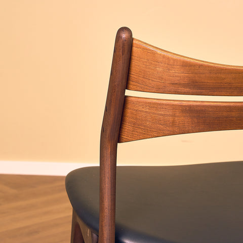 Danish dining chairs in walnut and teak by Erik Buch for Chr. Christensen Møbelfabrik, model 310