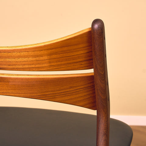 Danish dining chairs in walnut and teak by Erik Buch for Chr. Christensen Møbelfabrik, model 310