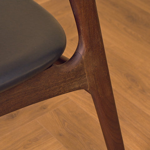 Danish dining chairs in walnut and teak by Erik Buch for Chr. Christensen Møbelfabrik, model 310