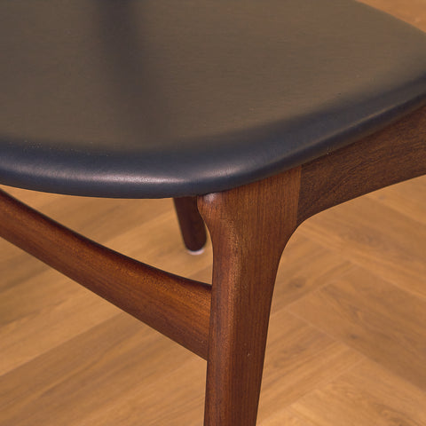 Danish dining chairs in walnut and teak by Erik Buch for Chr. Christensen Møbelfabrik, model 310