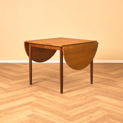 Danish dining table with 4 extensions in teak "Arne Vodder style"