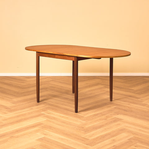 Danish dining table with 4 extensions in teak "Arne Vodder style"