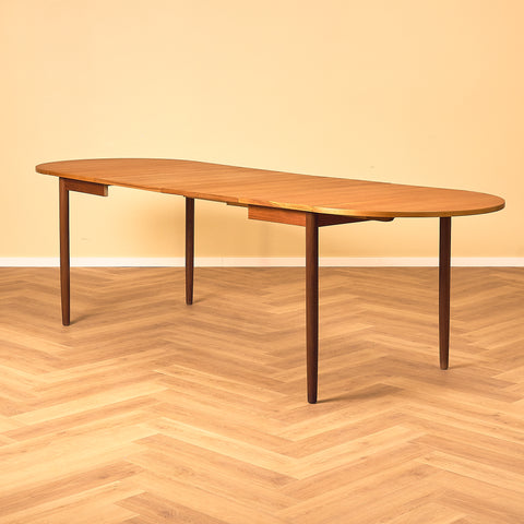 Danish dining table with 4 extensions in teak "Arne Vodder style"