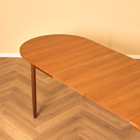 Danish dining table with 4 extensions in teak "Arne Vodder style"