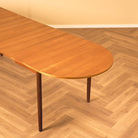 Danish dining table with 4 extensions in teak "Arne Vodder style"