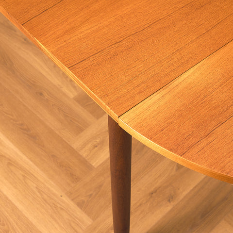 Danish dining table with 4 extensions in teak "Arne Vodder style"