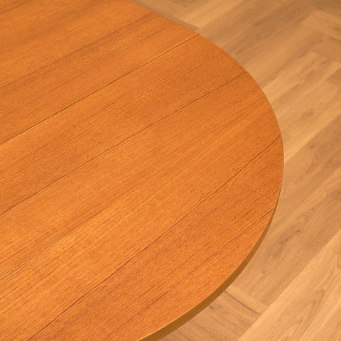 Danish dining table with 4 extensions in teak "Arne Vodder style"