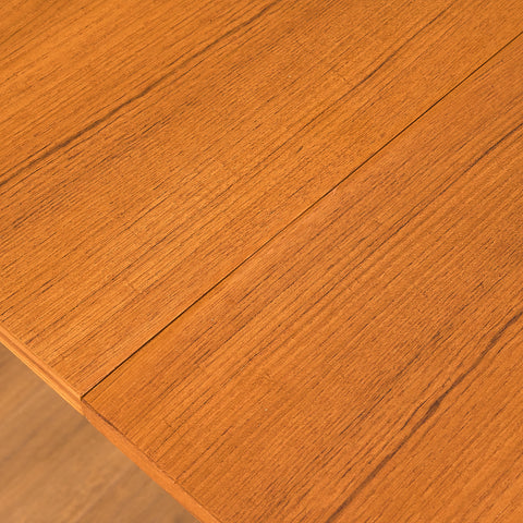 Danish dining table with 4 extensions in teak "Arne Vodder style"