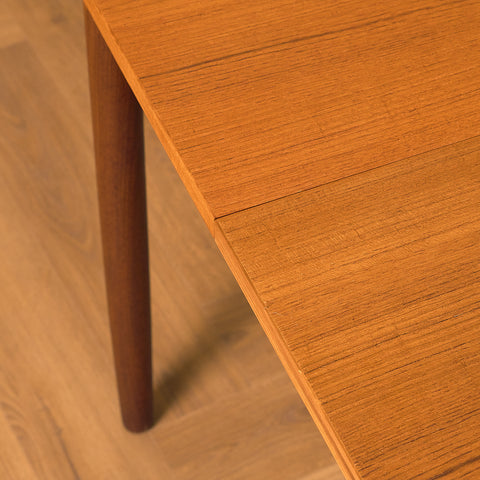 Danish dining table with 4 extensions in teak "Arne Vodder style"