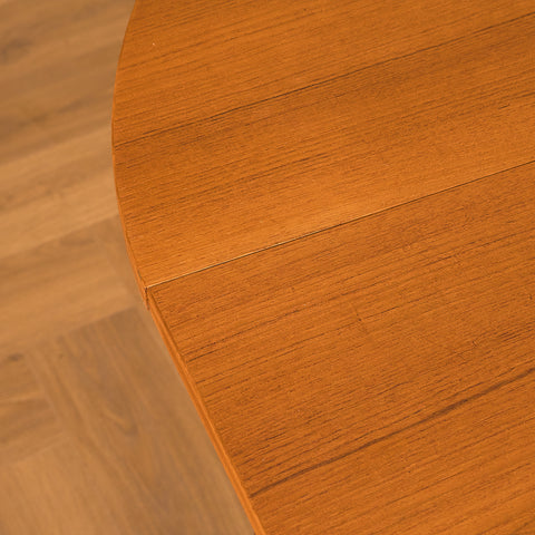 Danish dining table with 4 extensions in teak "Arne Vodder style"