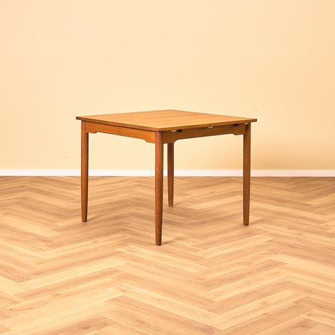 Danish dining table with 4 extensions in teak "Arne Vodder style"