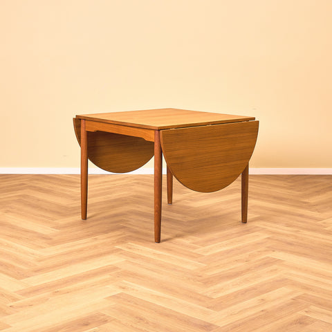 Danish dining table with 4 extensions in teak "Arne Vodder style"
