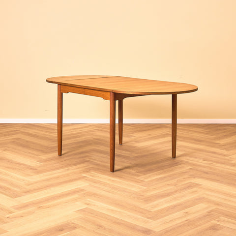 Danish dining table with 4 extensions in teak "Arne Vodder style"