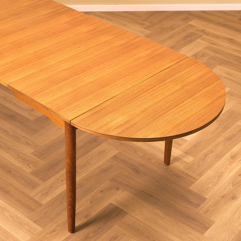 Danish dining table with 4 extensions in teak "Arne Vodder style"