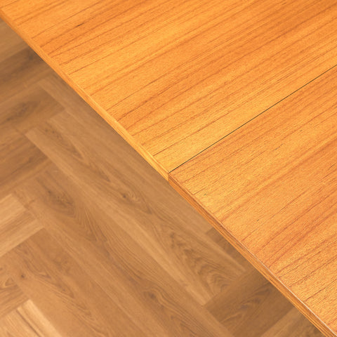 Danish dining table with 4 extensions in teak "Arne Vodder style"