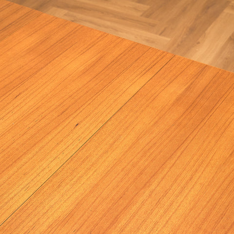 Danish dining table with 4 extensions in teak "Arne Vodder style"