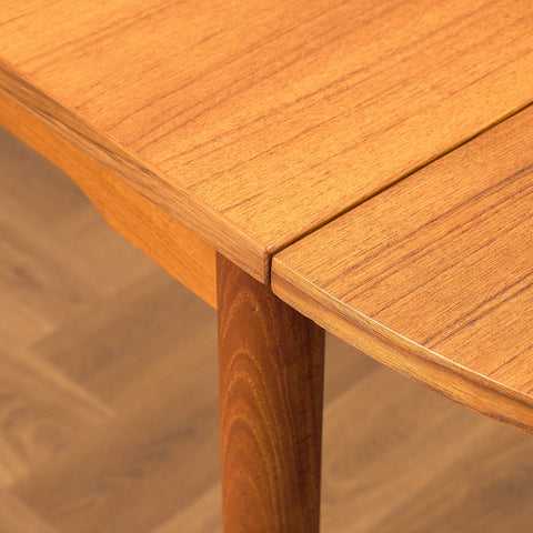 Danish dining table with 4 extensions in teak "Arne Vodder style"