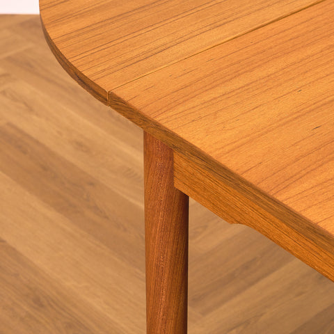 Danish dining table with 4 extensions in teak "Arne Vodder style"