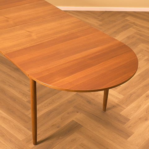 Danish dining table in teak and oak "Arne Vodder style"