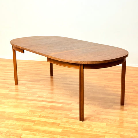 Swedish oval dining table in walnut by Bertil Fridhagen